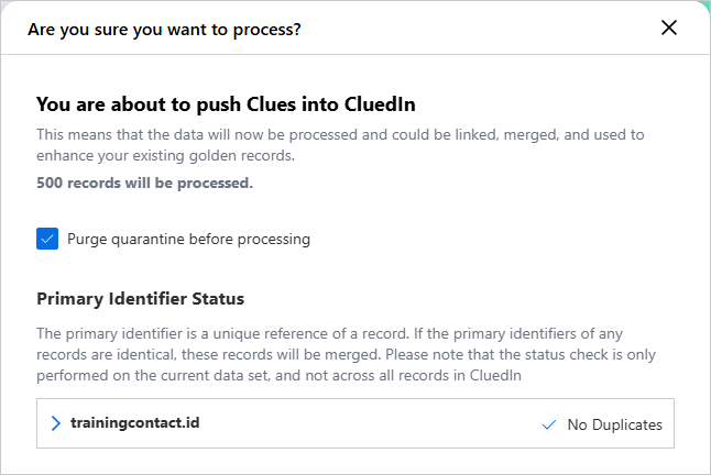The confirmation dialog saying 500 records will be processed, with Primary Identifier Status showing No Duplicates for trainingcontact.id